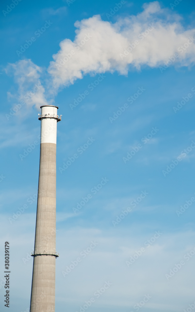 A Tall Smoke Stack Releasing Pollution into the Sky A Tall Smoke Stack Releasing Pollution into the Sky