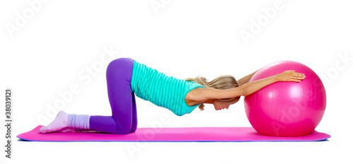 Foto Beautiful fitness girl and boll isolated on white