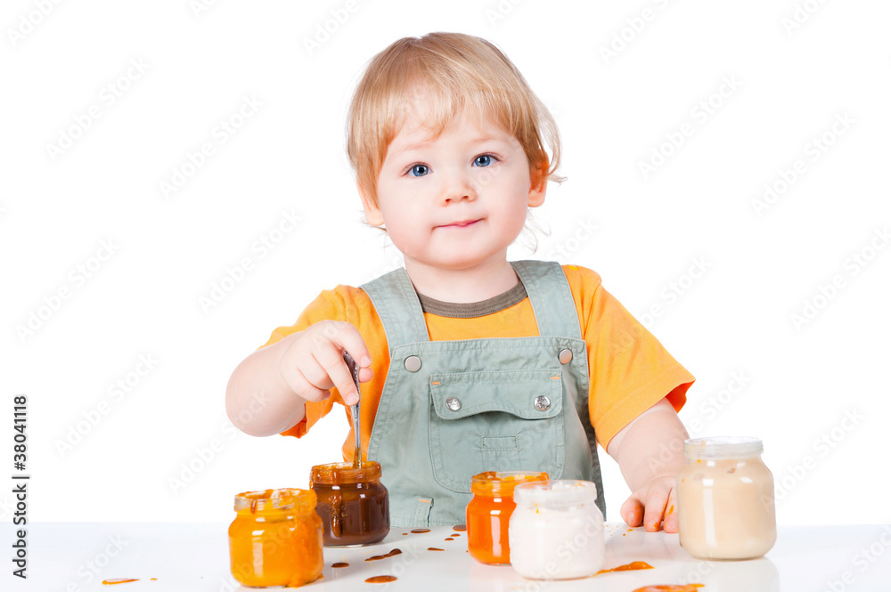 child eats with a spoon child eats with a spoon