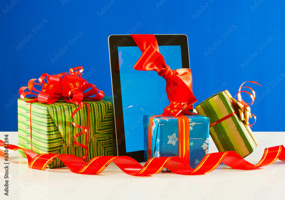 Presents with a tablet pc against blue background