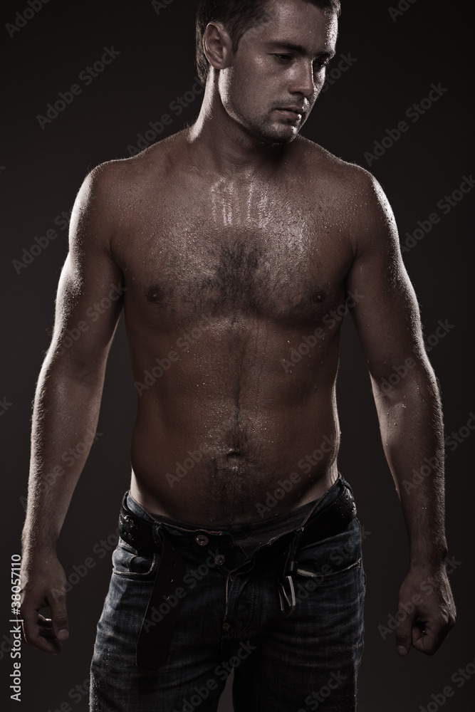 athletic young man with dewdrops on body athletic young man with dewdrops on body
