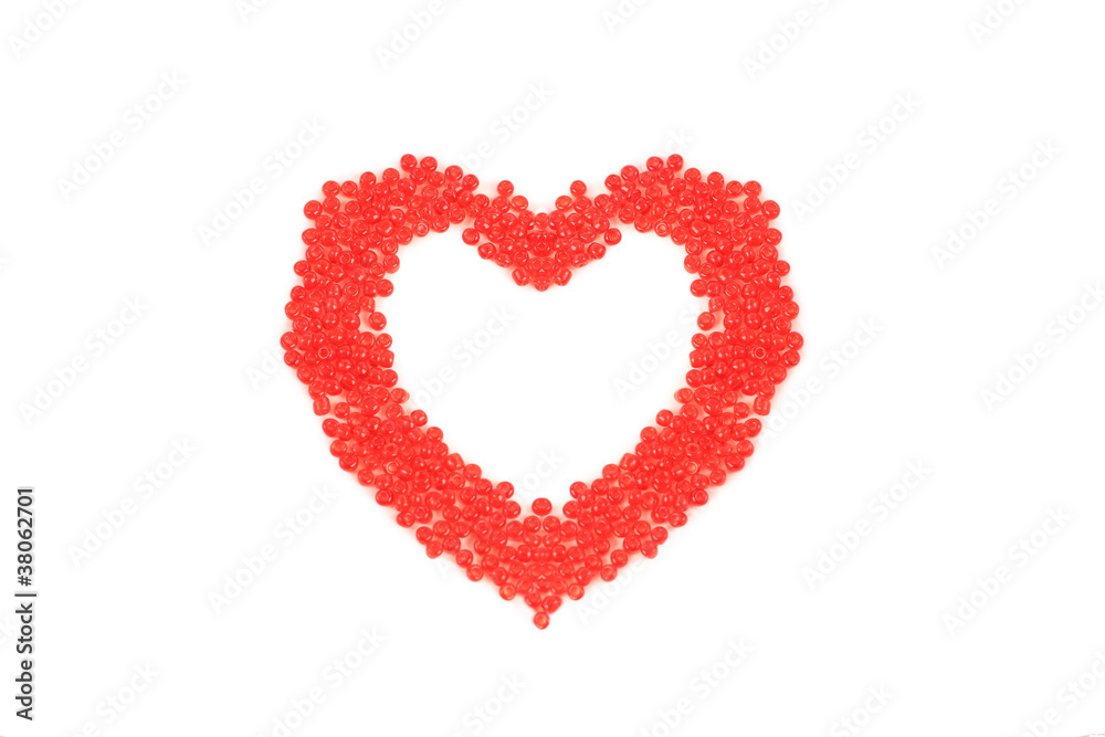 Heart made ??of red beads, isolated on red background.