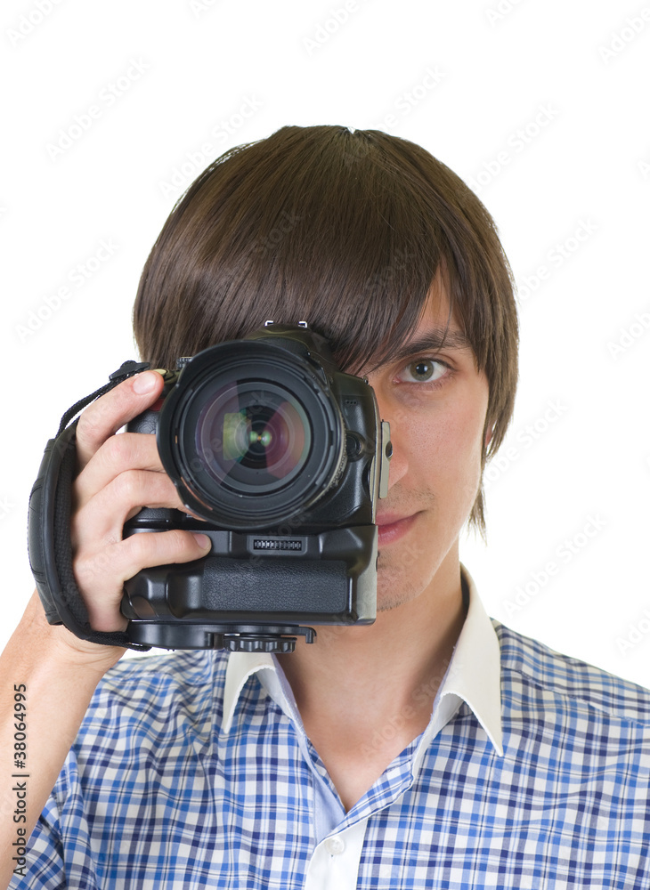 young man photographer doing photos by digital camera young man photographer doing photos by digital camera