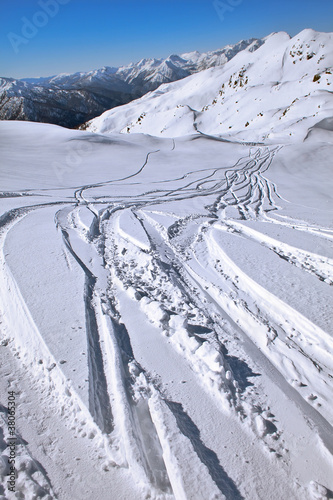 Ski tracks on snow photo