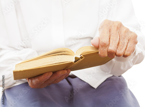 a book in an old woman's hand