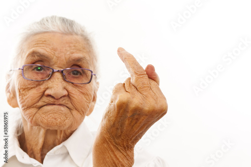 Old woman showing F finger