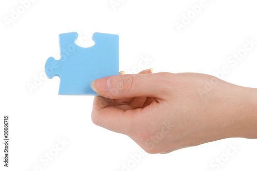 Hand and puzzle, isolated on white
