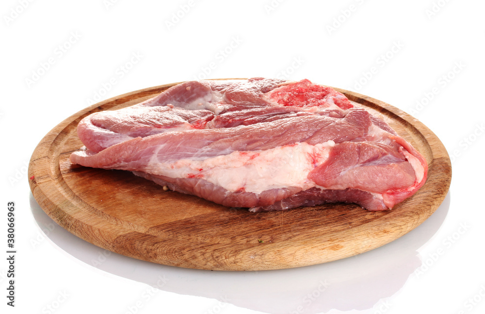 Raw meat on a wooden board isolated on white Raw meat on a wooden board isolated on white