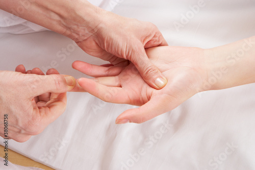 Detail hand reflexology massage photo