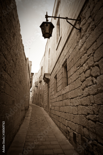 Retro photo of  narrow town street