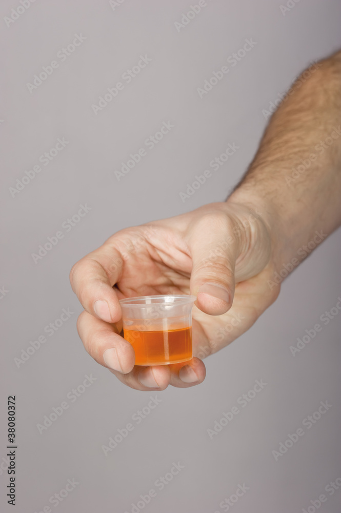 Syrup in a mensural glass Syrup in a mensural glass