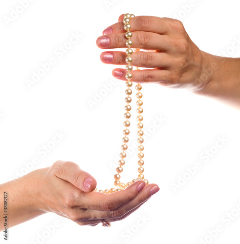 hands with a pearl necklace