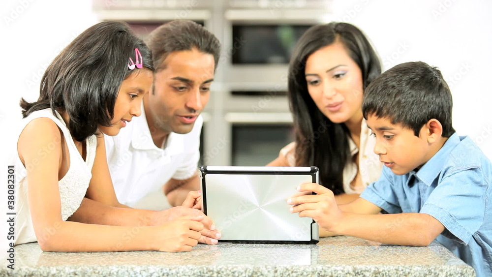 Asian Family Playing on Wireless Tablet Asian Family Playing on Wireless Tablet