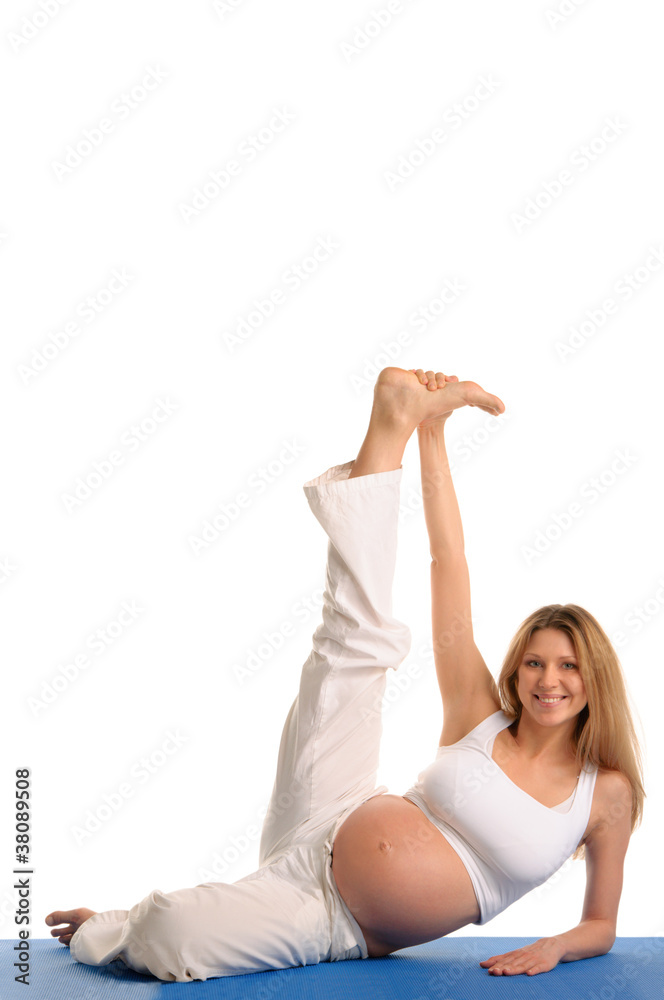 pregnant woman lying down and practicing yoga pregnant woman lying down and practicing yoga