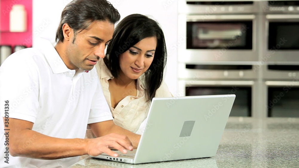 Asian Couple with Laptop Having Online Success Asian Couple with Laptop Having Online Success