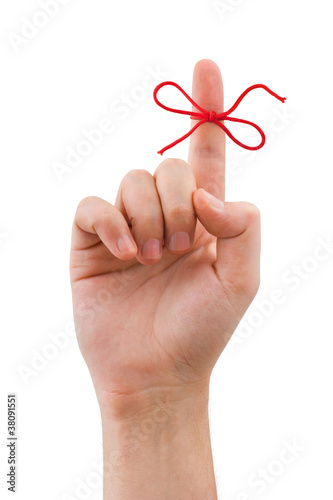Obraz na płótnie Red bow on finger w salonie