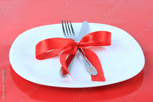 Romantic Dinner on red background. Place setting for Valentine's