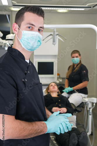 Dentist with nurse and patient