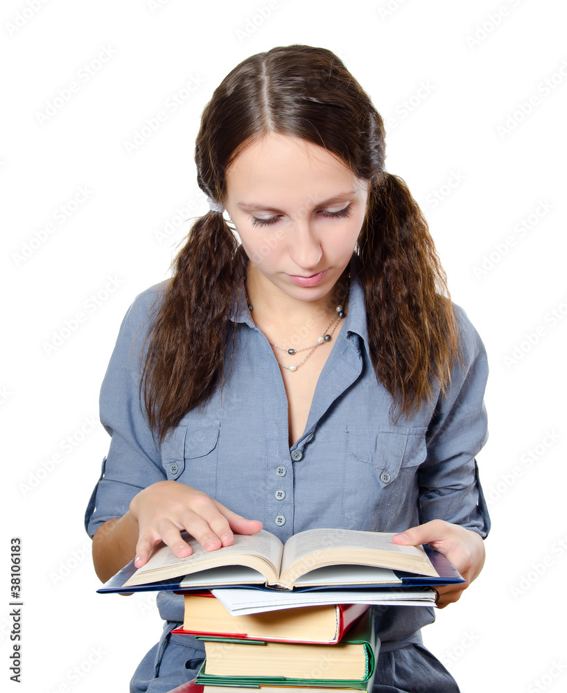 The beautiful girl with books isolated on white The beautiful girl with books isolated on white