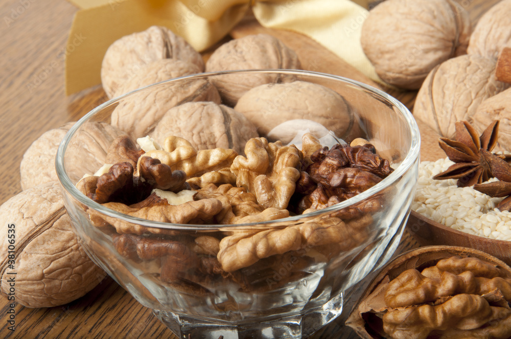 Walnut, wood nut, anise and sesame against a dark background Walnut, wood nut, anise and sesame against a dark background
