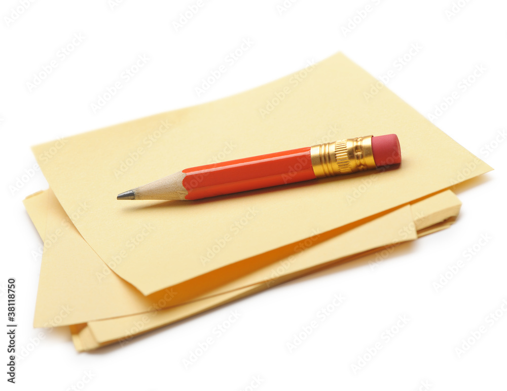 Paper note and a red pencil Paper note and a red pencil