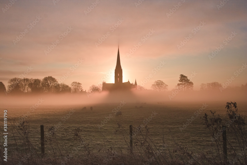 Salisbury cathedral on a misty morning