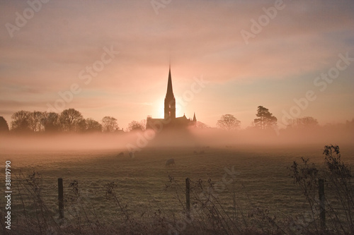Salisbury cathedral on a misty morning © julianelliott