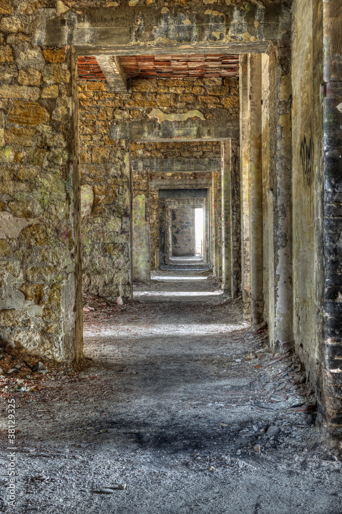 Long empty corridor and doors in abandoned building