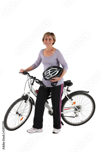 mature blonde woman with a bike