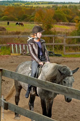 girl rides a horse photo