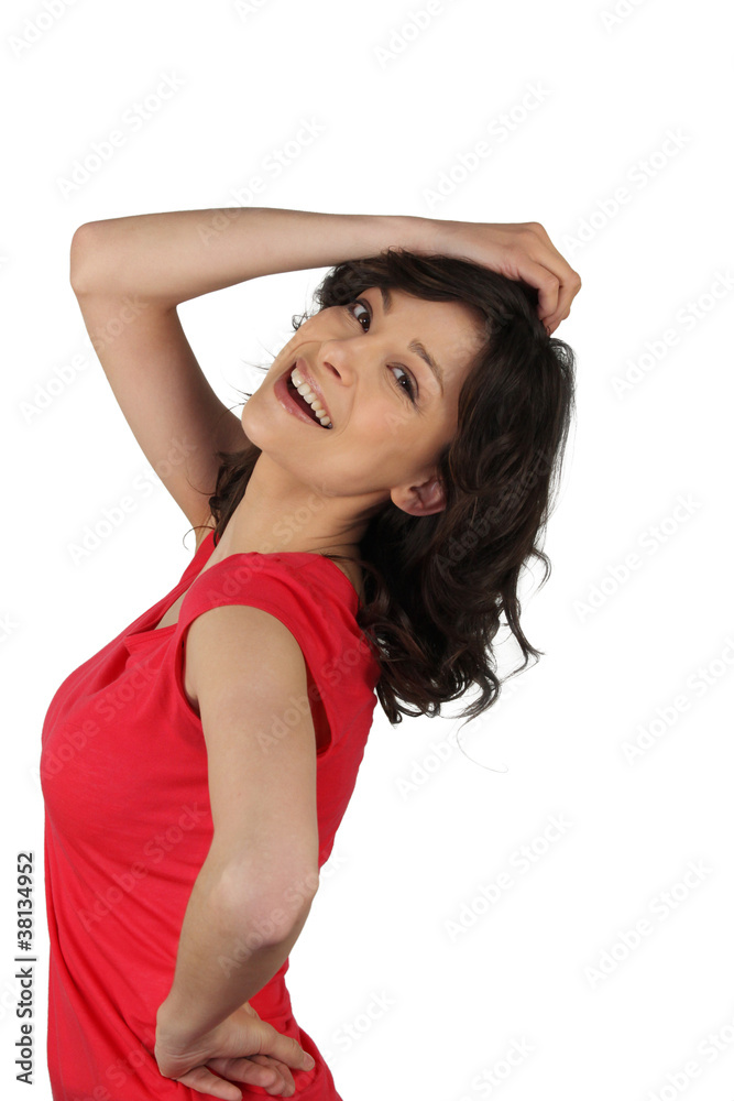 Young woman cheerful posing like a pin-up Young woman cheerful posing like a pin-up