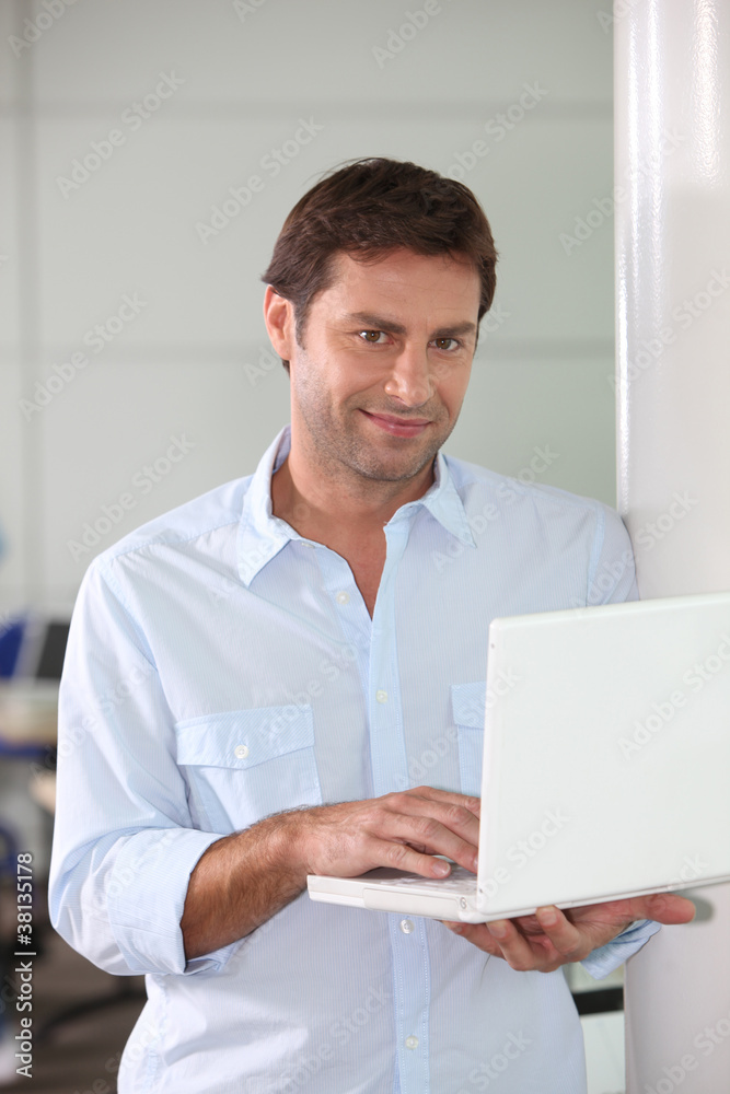 Man with computer in hand Man with computer in hand