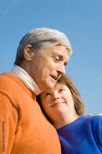 Fotografie A girl with Down syndrome and her grandmother