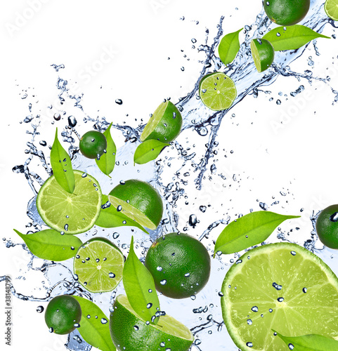Limes falling in water splash, isolated on white background #38148799