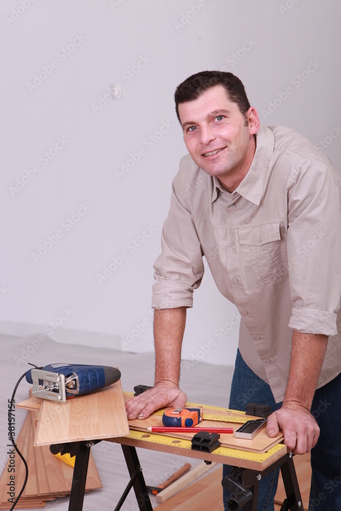 portrait of a man with electric saw