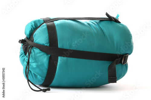 Packed sleeping-bag on white background photo