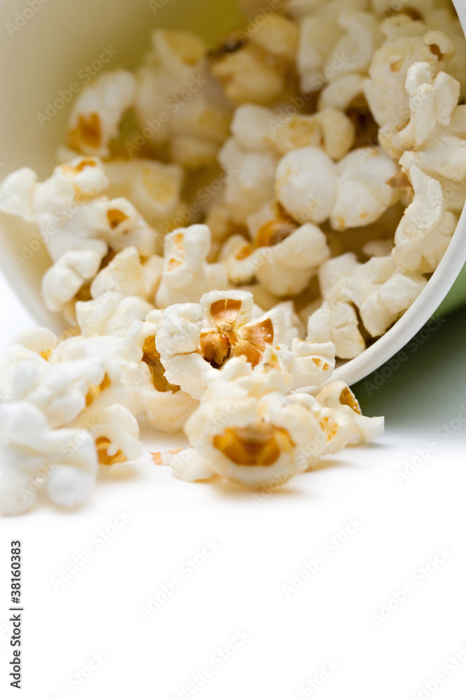 Popcorn in a green paper cup Popcorn in a green paper cup