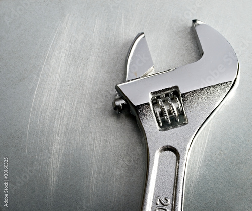 Spanner on the steel background