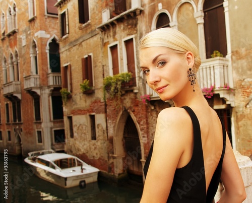 Blond lady against Venice canal. © Nejron Photo