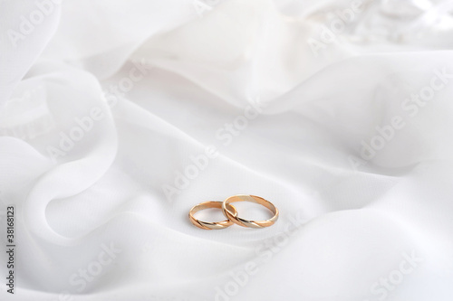 White  fabric and wedding rings
