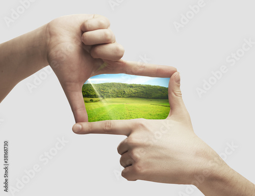 Photo of green field in hands