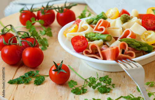 Delicious heart-shaped pasta with tomatoes and asparagus © Ekaterina Pokrovsky