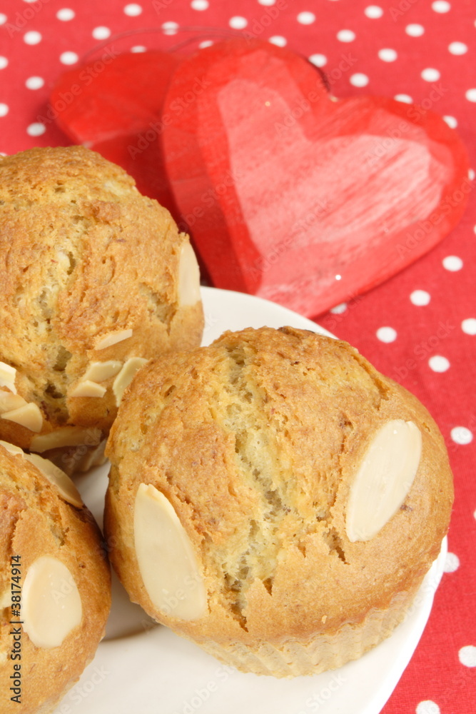 almond muffins with red hearts - obrazy, fototapety, plakaty 
