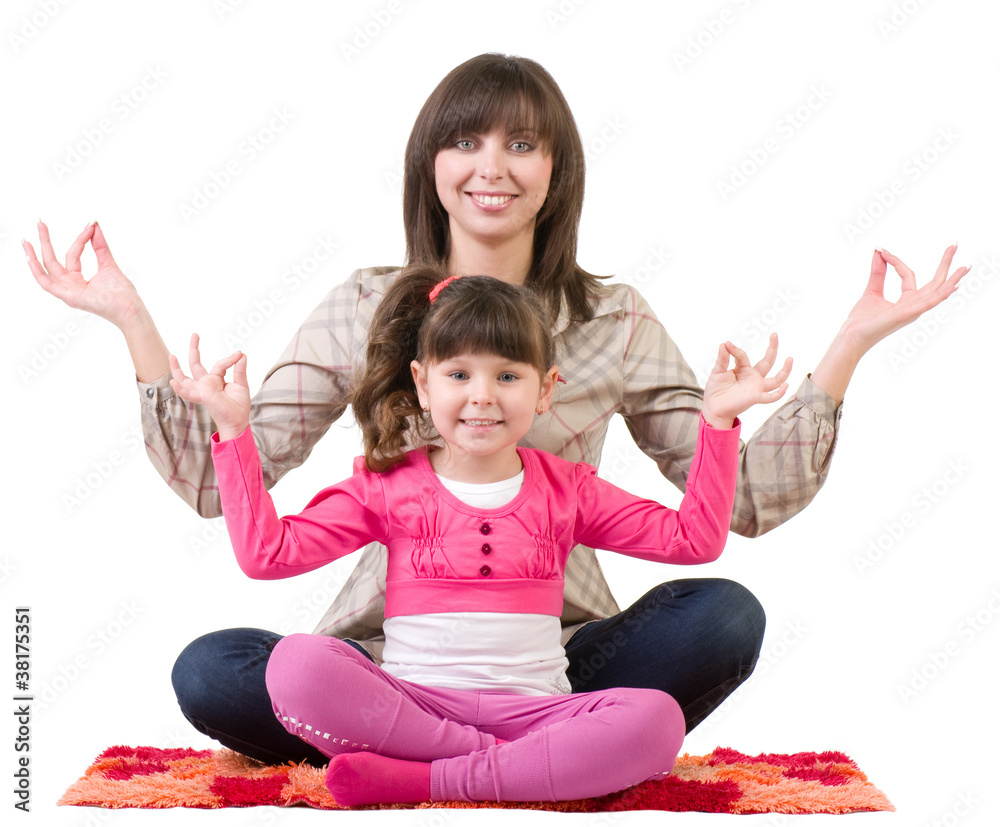 young mother and her little daughter embracing in meditation young mother and her little daughter embracing in meditation