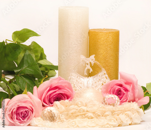 Romantic still-life with white candle and roses