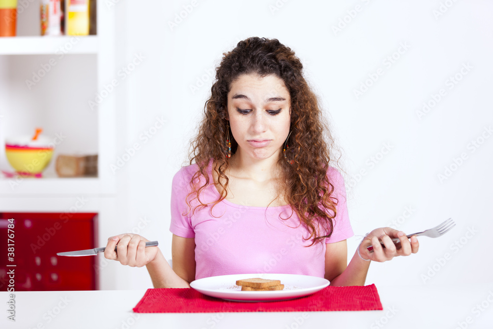unhappy woman at her breakfast