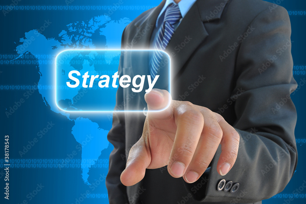 businessman hand pushing strategy button businessman hand pushing strategy button