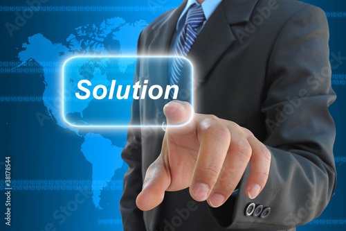 businessman hand pushing solution button