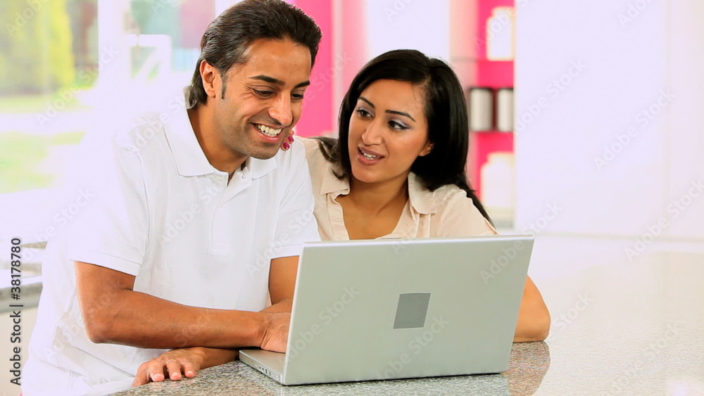 Young Asian Couple Using Laptop Computer Young Asian Couple Using Laptop Computer