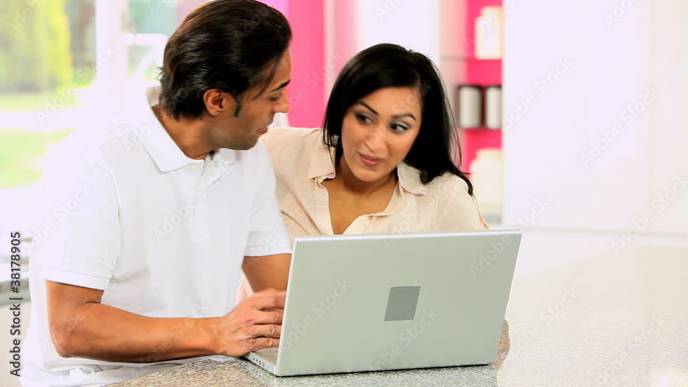 Asian Couple with Laptop Having Success Online Asian Couple with Laptop Having Success Online
